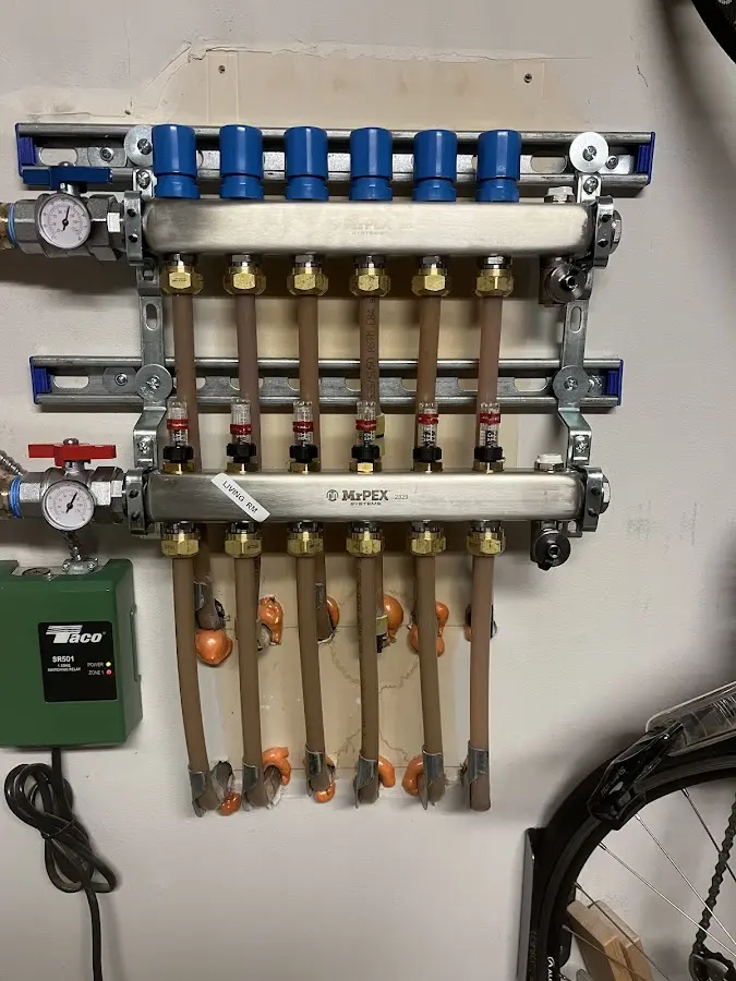 Plumber performing Leak Detection at a residential property in Pomfret